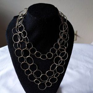 Gold toned ring necklace.